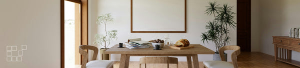 Dining room wall art setting with wooden table and empty frame