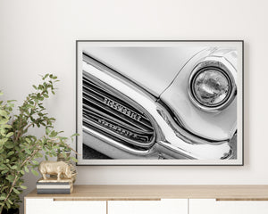 1956 Super 88 detail with a circular headlight and layered chrome reflections