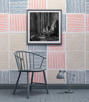 A curved metal chair frame amid broken wood beneath narrow strips of light.