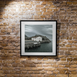 Moody photograph of an abandoned Mortsund waterfront building beside the sea