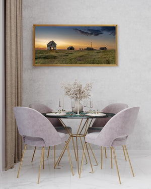 Wide colour landscape photograph of an abandoned Saskatchewan farm at dusk.