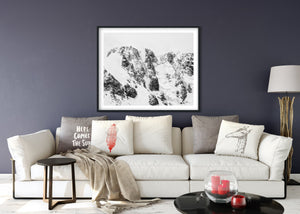Close view of Antarctic rock textures surrounded by deep snow.