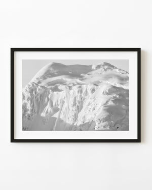 Black and white Antarctic mountain detail with rounded snow caps and steep grooves.