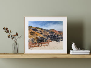 Layered clay cliffs with low green vegetation along the Aquinnah shoreline.