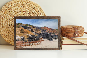 Warm earth tones and dark cliff faces above the sandy beach at Aquinnah.