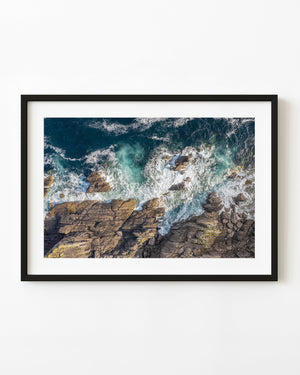 Atlantic surf spreads white foam around fractured rocks at Slea Head on Ireland’s Dingle Peninsula.