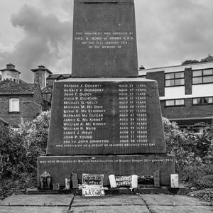 Square monochrome view of Derry’s stone Bloody Sunday monument.
