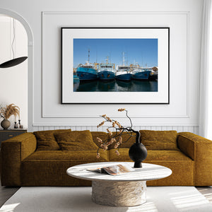 Fishing vessels face the camera beneath slender masts and antennas.