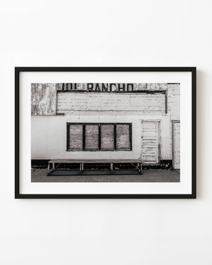 Boarded restaurant facade in Zion, Illinois, photographed in black and white