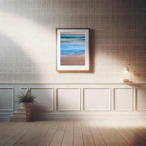 Vertical beach photograph contrasting cool surf with warm sunset colour on wet sand.