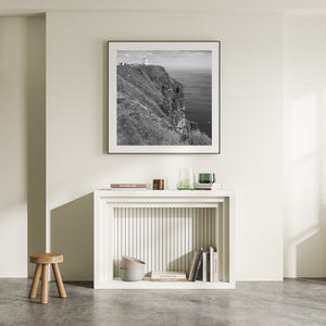 Square black and white Irish landscape photograph with the Cliffs of Moher, a tower and open sea.