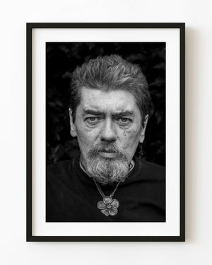 Black and white street portrait of a bearded man in Dublin