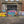 Graffiti-covered Cooperage entrance beneath weathered brickwork