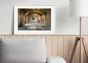 A symmetrical view through Fort Jefferson’s repeating arches and brick columns.