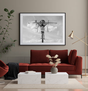 A low-angle view shows the wings and long legs of a giant Ontario mosquito sculpture