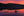 A glowing coral sky and dark forest mirror across still lake water