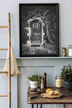 Tangled branches frame a quiet Hampton Court entrance marked private