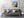 Weathered stone ramparts around the Castillo de la Real Fuerza moat under blue skies.
