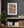 Colour street photograph of London graffiti and stickers with a prominent painted face