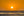 Sun setting over calm Pacific waves near Los Angeles