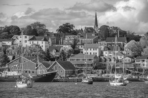 Sailboats anchored below Lunenburg’s hillside houses and church spire