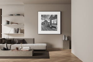 Black and white coastal architecture with weathered windows and nautical gear