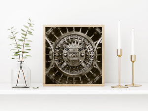 Sepia-toned industrial detail of concentric rings and polished vault hardware