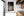 Selective focus isolates wine bottles among softly blurred rows