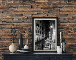 Quiet Venice waterside path and balconies photographed in black and white
