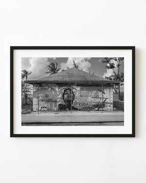 Black and white graffiti woman on abandoned building in Nassau Bahamas