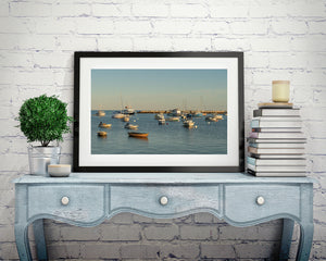 Anchored fishing boats and dinghies in a sheltered harbour
