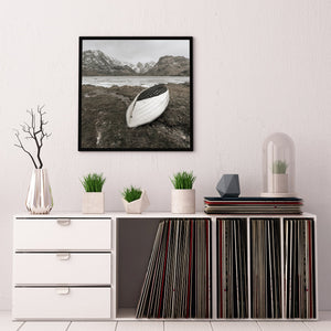 Muted winter landscape with a rowboat resting on dry ground
