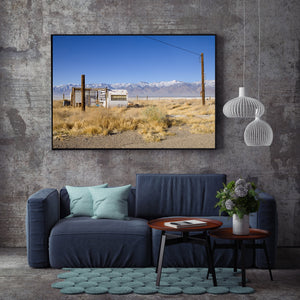 Sunny landscape with an aging trailer in open dry country