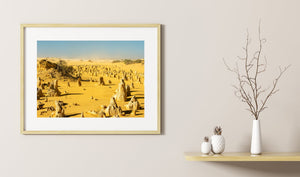 Colour photograph of the Pinnacles Desert’s limestone formations and yellow dunes