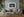 Illuminated domed building below Prague Castle across the Vltava