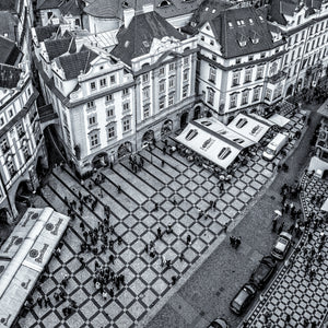 Historic Prague rooftops and patterned city square from above
