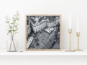 Geometric stone plaza and surrounding buildings in Prague