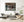 Exposed timber ceiling above broken furnishings in Pruce’s Motor Inn