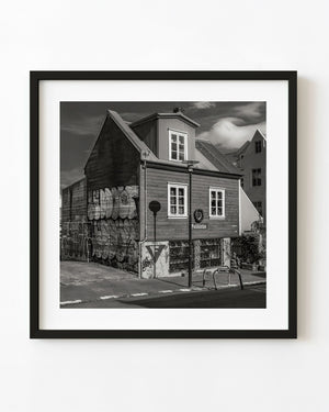 Graffiti covered wooden house in Reykjavik black and white