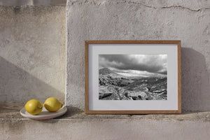 Textured stone slabs and lichen across a rocky Irish landscape