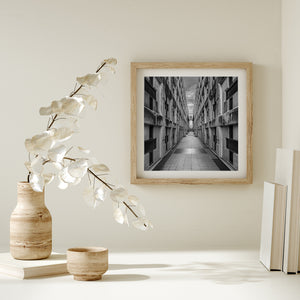 Repeating geometric wall panels leading toward a distant opening