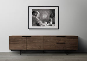 Monochrome detail of a resting diner beside a bottle and glass shaker