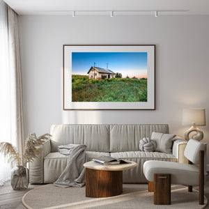 Colour rural landscape with a neglected house and abundant greenery