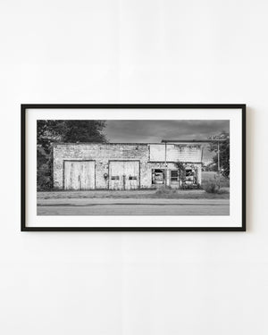 Abandoned South Whitley service station in black and white