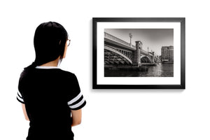 Monochrome London photograph of Southwark Bridge from the riverside