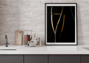 Golden sparkling wine and illuminated glass edges on a dark background.