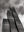 Stepped glass facade of St Regis Chicago rising into a cloudy sky.
