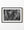 Tibetan carved stone tablets stacked at angles in a black and white detail photograph.