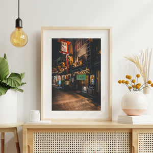 Amber lights and traditional wooden facades on a Tokyo restaurant street
