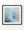 White sea foam churns through pale blue water in a square abstract photograph.